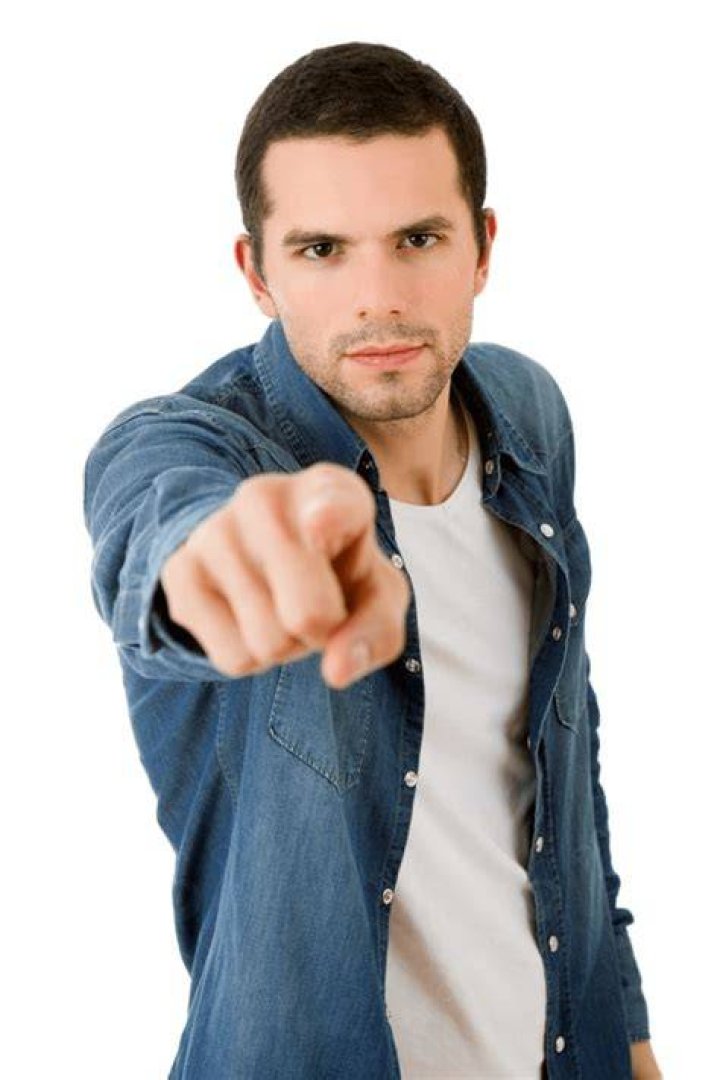 Download A Man Is Pointing His Finger At The Camera Wallpaper