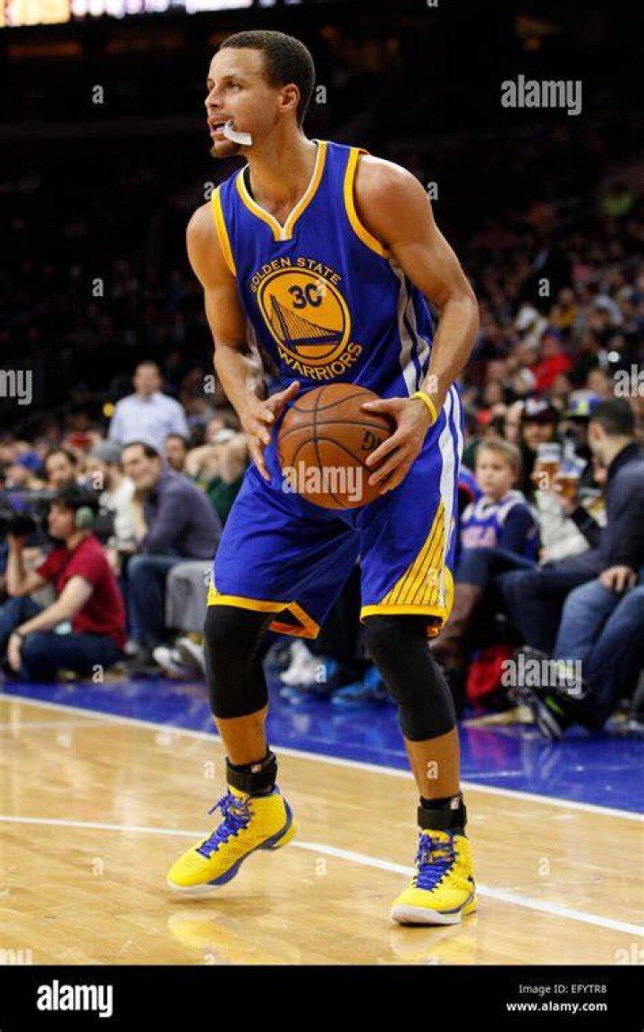 Golden State Warriors guard Stephen Curry speaks with his daughter