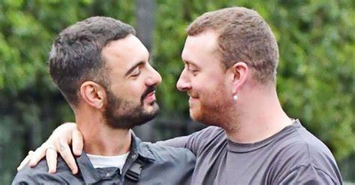 Sam Smith cuddles and snogs their new boyfriend in very passionate