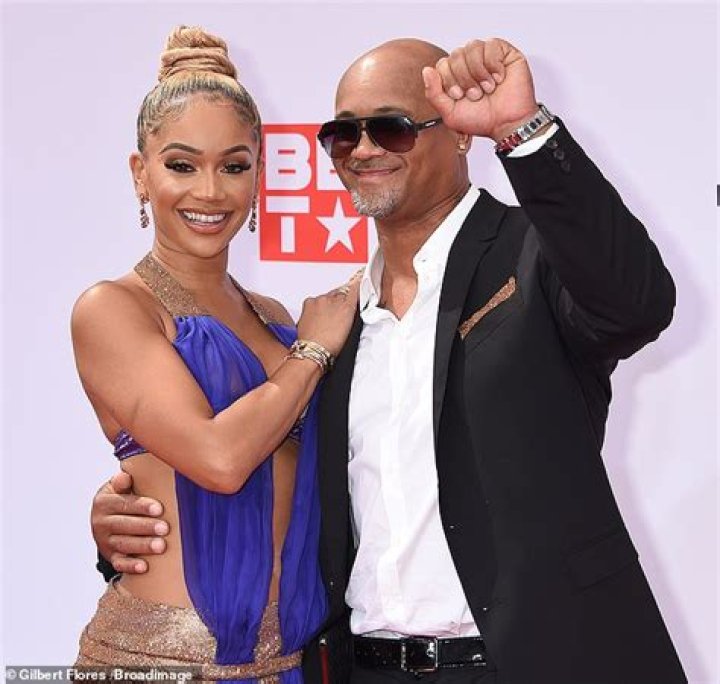 Saweetie dons Dolce & Gabbana and brings her father Johnny Harper as