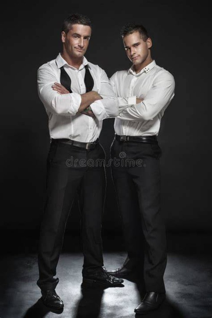 two men are posing for the camera with their heads turned to look like