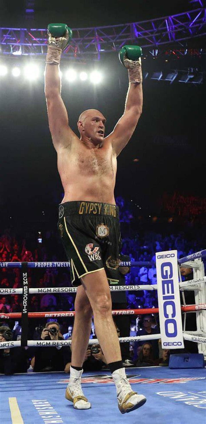 Tyson Fury's son Prince John James poses with WWE chief Vince McMahon